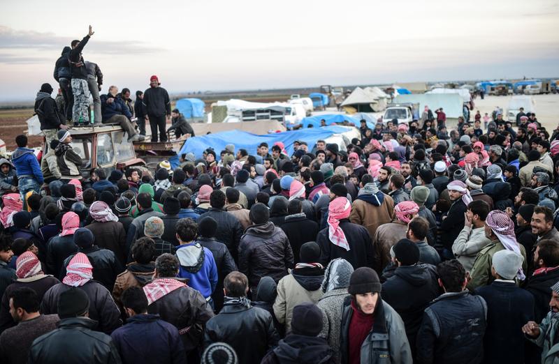 Syrians fleeing the northern embattled city of Aleppo wait on February 5, 2016 in Bab-Al Salama.