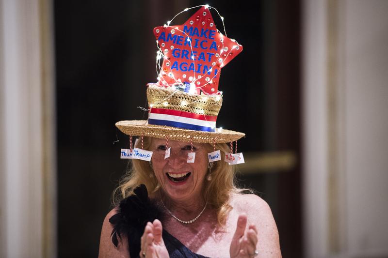 Rosemary Harder shows off her hat before republican presidential candidate Donald Trump speaks at a campaign press conference at the Mar-a-Lago club in Palm Beach, Florida on Tuesday March 15, 2016.