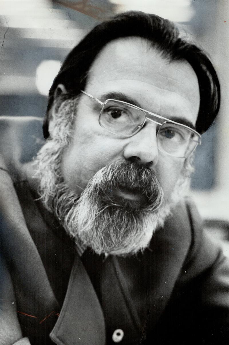 Stan Fischler with hockey book No. 42, February, 1975.