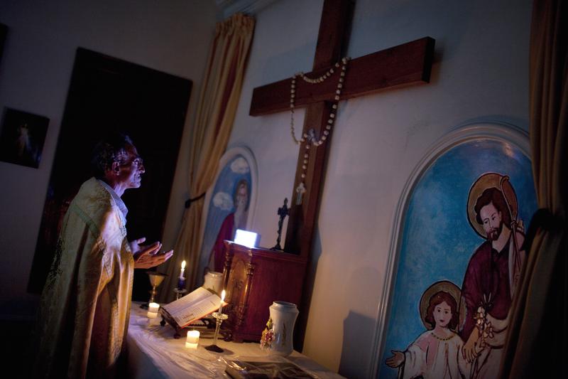 Syrian Christian Michael Oberi prays in the chapel of Mar Elias House, a church hostel for the indigent in the old City of Aleppo, on September 16, 2013.