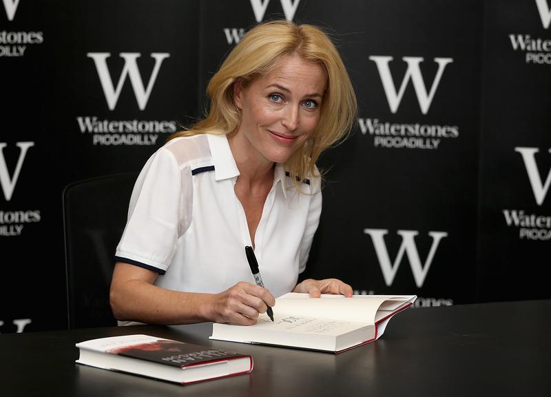 Gillian Anderson signs copies of her new book 'Vision of Fire' at Waterstone's, Piccadilly on October 3, 2014 in London, England.