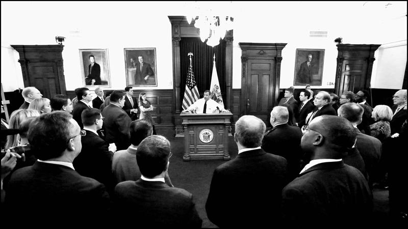 New Jersey Governor Chris Christie talks with Cabinet Senior Staff after 2015 State of the State address.