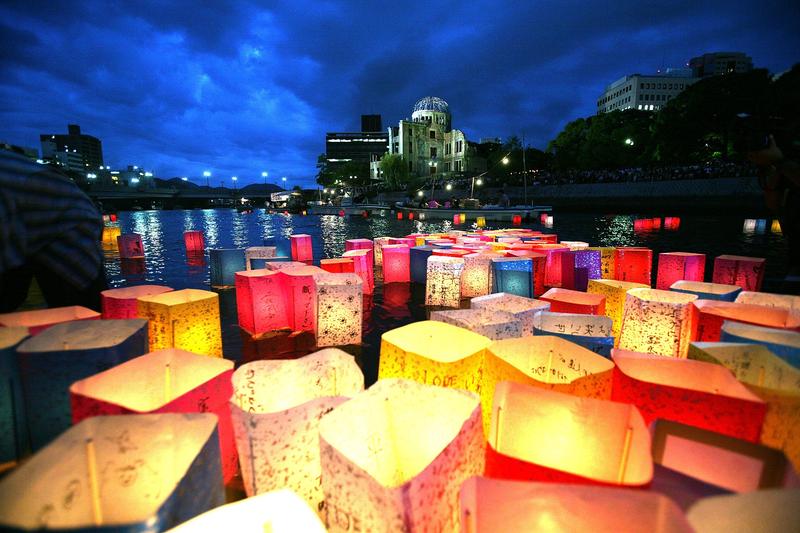 Candles and paper lanterns float on the Motoyasu River in front of the Atomic Bomb Dome at the Peace Memorial Park, in memory of the victims on the 62nd anniversary of the Hiroshima bomb.