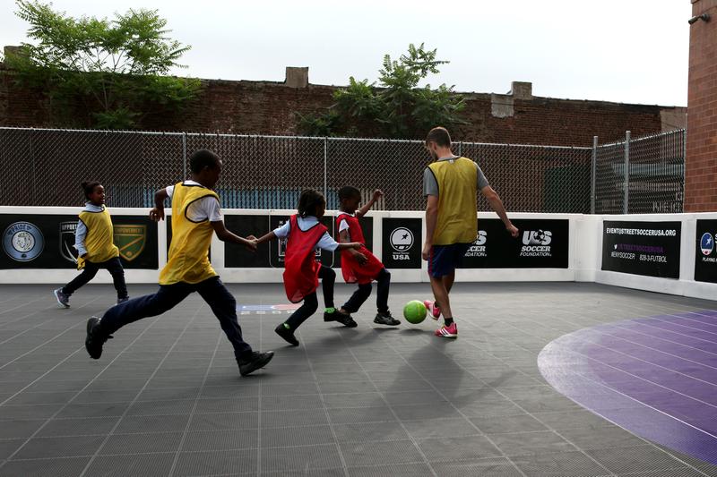 A scrimmage in East New York, led by the coaches at Street Soccer USA.
