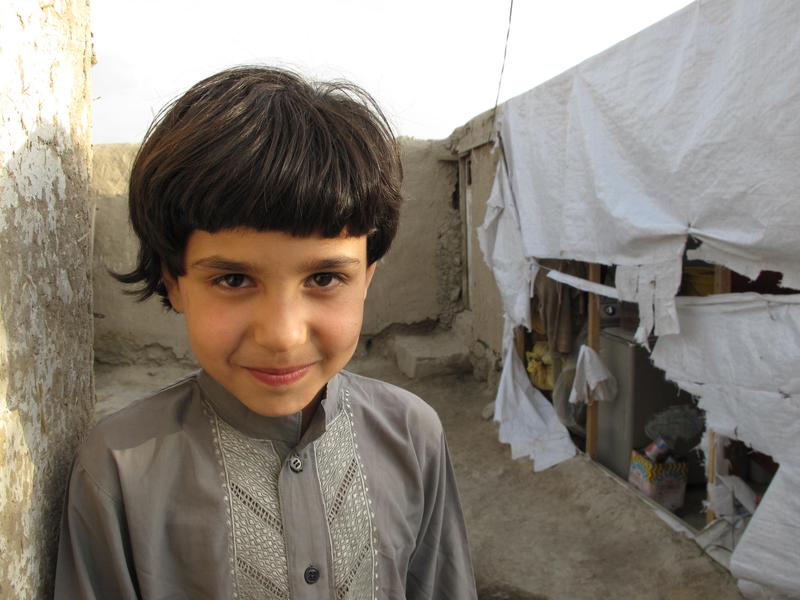 Niima attends school each morning in a dress and a headscarf. Then she returns home and changes into “Abdul,” and goes to work in a small grocery store to earn money to help support her family.