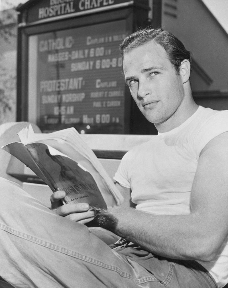 Marlon Brando reading Krishnamurti in front of a church. The books he read are among the many things that helped shape his performances.