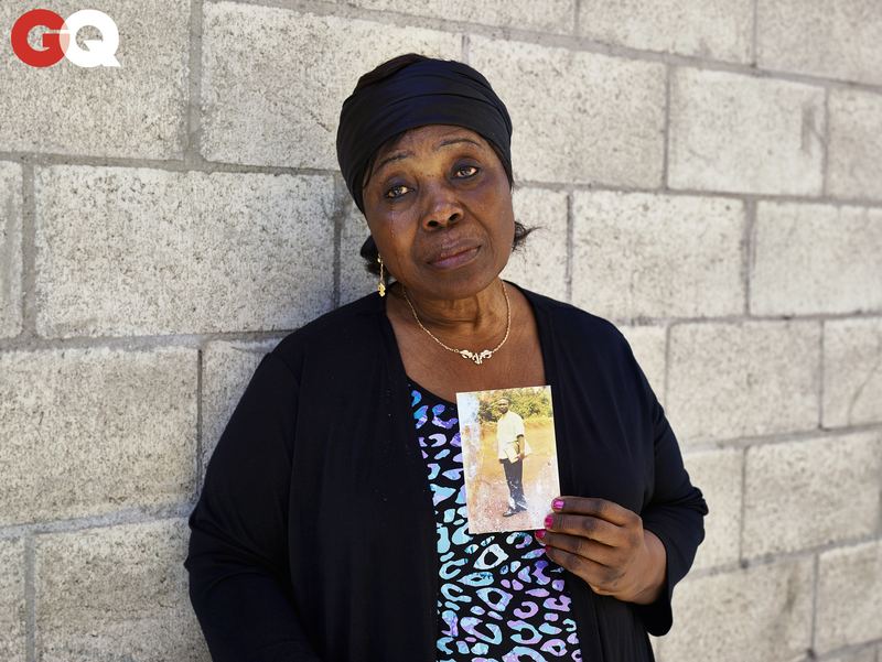 Heleine Tchayou, Charly's mother, holds a photograph of him as a student in Cameroon, before Paris, before America, before Skid Row.