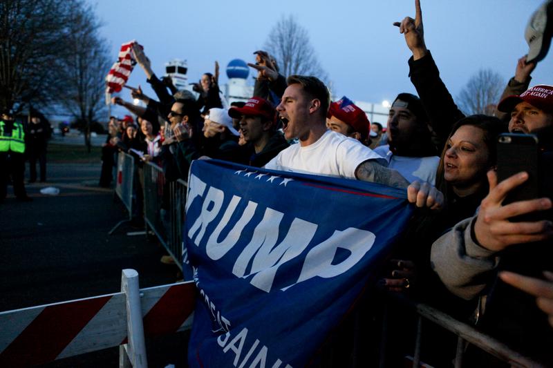 Supporters of Donald Trump rallied outside of his campaign event in Bethpage, Long Island. They faced off against more than 100 protesters on the other side of barriers.