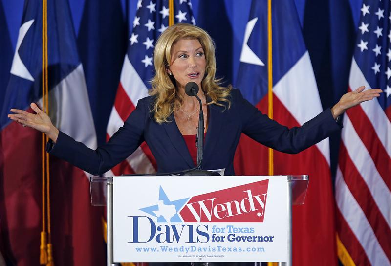 Texas State Sen. Wendy Davis (D) speaks at the podium as she announces her intentions to run for Texas Governor at the W.G. Thomas Coliseum in Haltom City on October 3, 2013 in Haltom City, Texas.