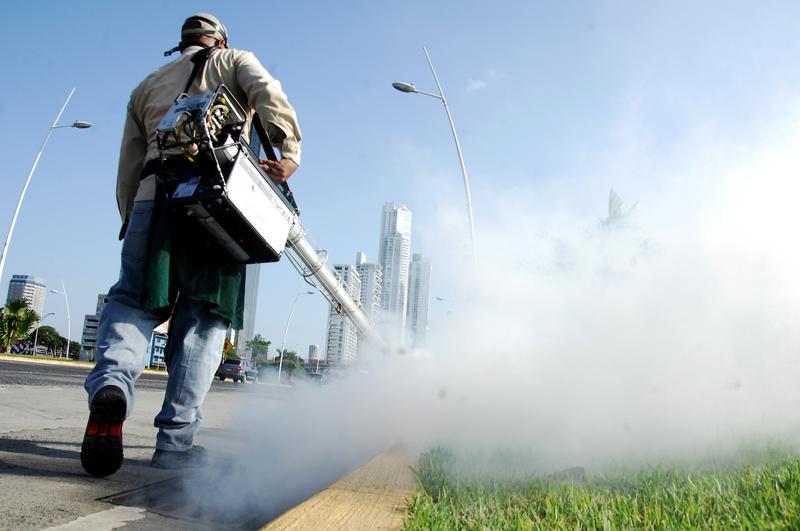 Health ministry workers fumigate against the Aedes aegypti mosquito, vector of the dengue, Zika and Chikungunya viruses in downtown Panama City on February 2, 2016.