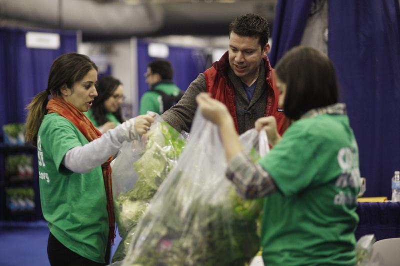 City Harvest volunteers rescuing fresh vegetables from the New York Produce Show to distribute to soup kitchens and food pantries in New York City. December 4, 2012