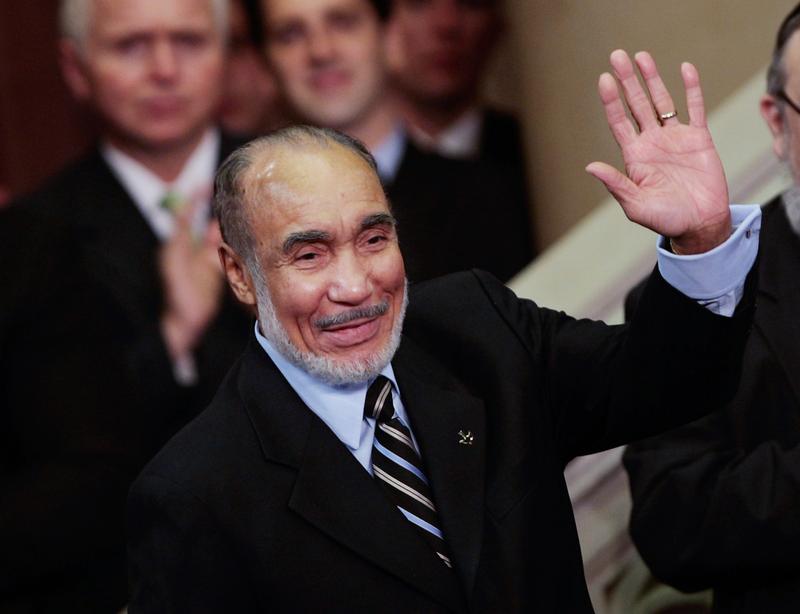 New York retired politician Basil Paterson, father of New York Gov. David Paterson, waves at his son's swearing-in ceremony March 17, 2008 in Albany.