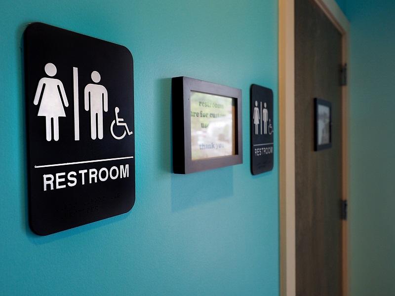 Unisex signs hang outside bathrooms at Toast Paninoteca on May 10, 2016 in Durham, North Carolina. Debate over transgender bathroom access spreads nationwide.