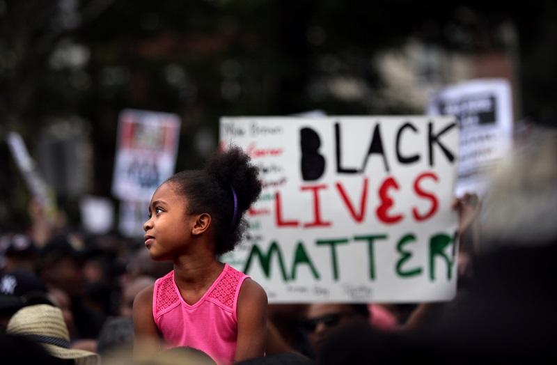 People march during a rally against police violence on August 23, 2014 in the Staten Island borough of New York City.