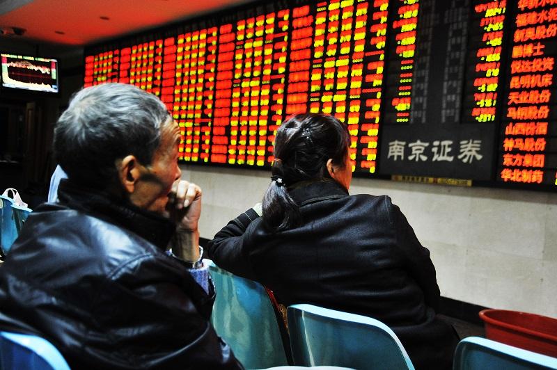nvestors observe stock market at a stock exchange hall on Nov. 23, 2015 in Nanjing, Jiangsu Province of China. The Shanghai Composite Index dropped 20.18 points or 0.56%, to close at 3,610.32 points.