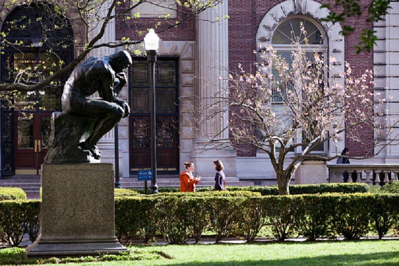 Students chat on campus at Columbia University in Morningside Heights in Upper Manhattan, on May 6, 2015 in New York, N.Y.
