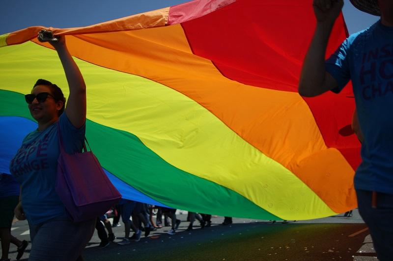 Marchers carry a rainbow flag in the LA Pride Parade on June 8, 2014 in West Hollywood, California. The LA Pride Parade and weekend events this year are emphasizing transgender rights and issues.