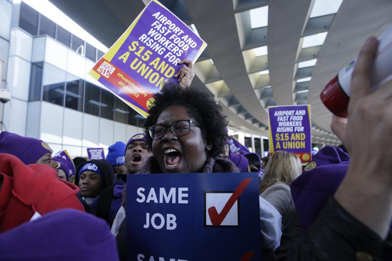Protesters gather at Chicago's O'Hare International Airport on Tuesday, Nov. 29, 2016, as part of a nationwide protest for a $15 per hour minimum wage.