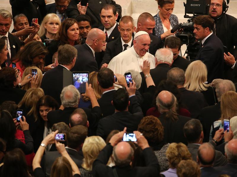 Pope Francis greets people as he leaves St. Patrick's Cathedral September 24, 2015 in New York City. The Pope is on his first trip to the United States, visiting Washington, DC, New York and Philadelp