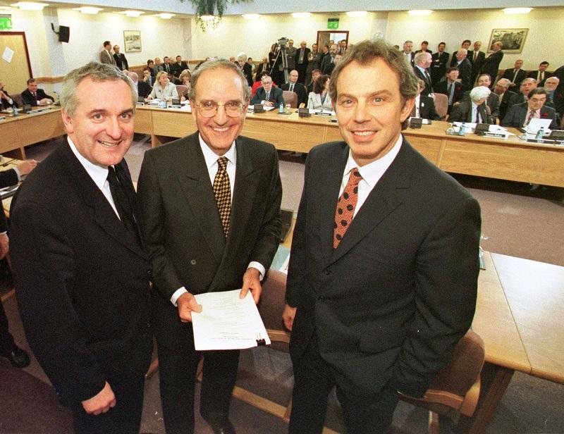 British Prime Minister Tony Blair, right, U.S. Senator George Mitchell, center, and Irish Prime Minister Bertie Ahern together after they signed the agreement for peace in Northern Ireland, 4/10/1998.