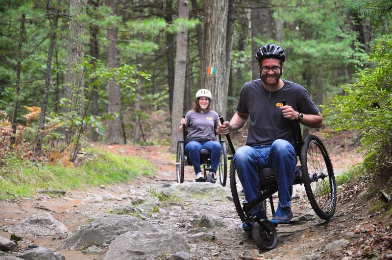 Benjamin Judge, co-founder of GRIT, and Tish Scolnik testing prototypes of the Freedom Chair on a local mountain biking trail.