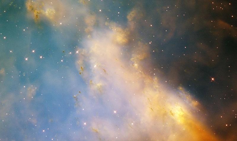 An aging star's last hurrah is creating a flurry of glowing knots of gas that appear to be streaking through space in this close-up image of the Dumbbell Nebula, taken with NASA's Hubble Telescope.
