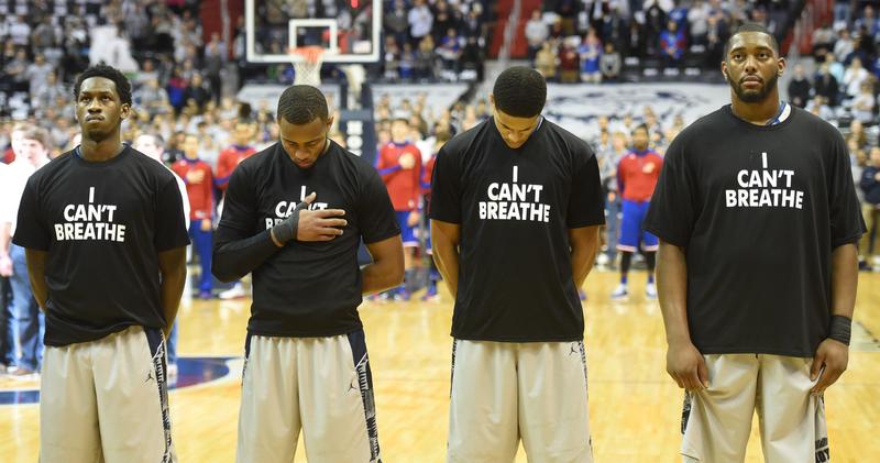 Members of the Georgetown University basketball team line up for the national anthem wearing 'I Can't Breathe' t-shirts to honor Eric Garner, who died while being placed in a police chokehold.