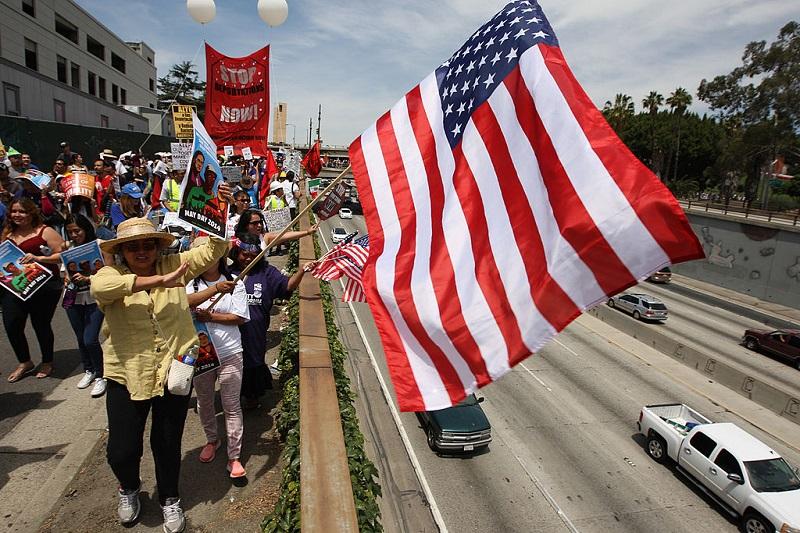 Marchers pass next to the 101 freeway, on their way to the Metropolitan Detention Center during one a several May Day immigration-themed events on May 1, 2014 in Los Angeles, California.