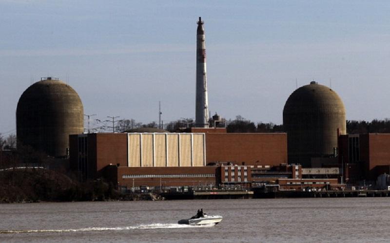 A boat moves along the Hudson River in front of the Indian Point nuclear power plant on March 18, 2011 in Buchanan, New York.