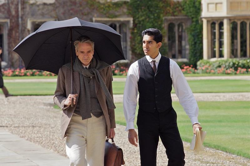 Hardy (Irons) and Ramanujan (Patel) walk through the Quad at Trinity College, Cambridge in Matthew Brown’s THE MAN WHO KNEW INFINITY.