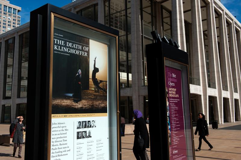Signs promote 'The Death of Klinghoffer' outside the Metropolitan Opera at Lincoln Center on October 20, 2014 in New York, NY.