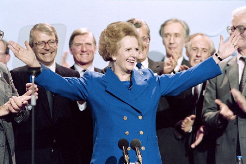 British Prime Minister Margaret Thatcher acknowledges applauds on Ocotber 13, 1989 at the end of the Conservative Party conference in Blackpool.