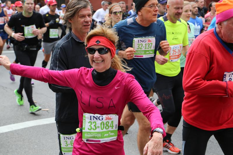Racers run through Williamsburg, Brooklyn during the running of the New York City Marathon on November 3, 2013 in New York City.