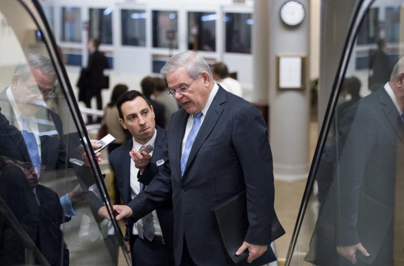 Sen. Bob Menendez, D-N.J., speaks with reporters as he heads to the Senate Democrats' policy lunch in the Capitol on Tuesday, March 3, 2015.
