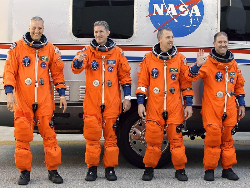 STS-125 Mission Specialists, from left, Mike Massimino, Drew Good, Andrew Feustel, and Jon Grunsfeld pose after leaving the operations and checkout building 5/11/09 in Cape Canaveral, Fla