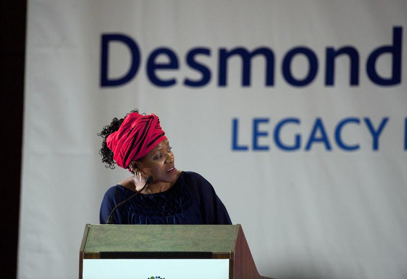 Reverend Mpho Tutu, daughter of Archbishop Desmond Tutu looks across at her father before the third annual Desmond Tutu International Peace Lecture, on October 7, 2013.