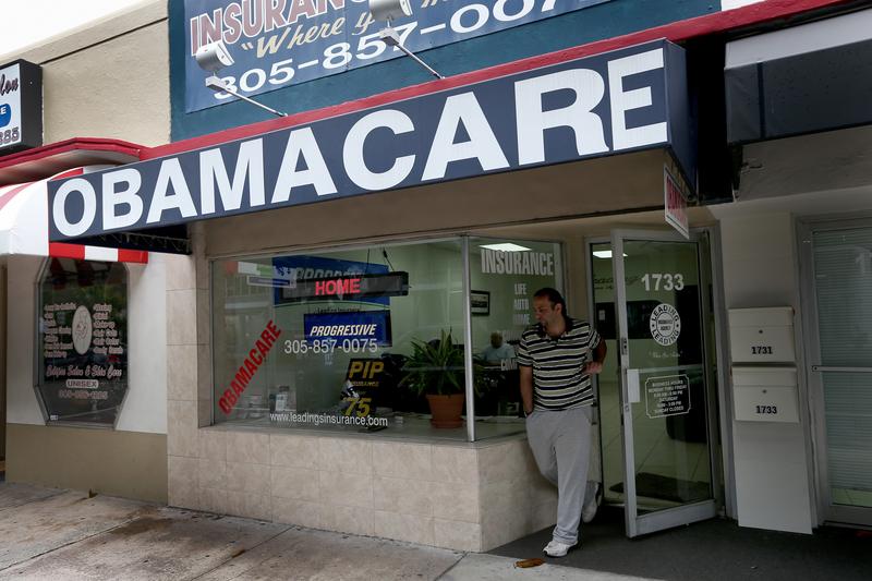 Baseel Farah walks out of Leading Insurance Agency as the insurance agency helps enroll people in health insurance plans under the Affordable Care Act on February 13, 2014 in Miami, Florida.
