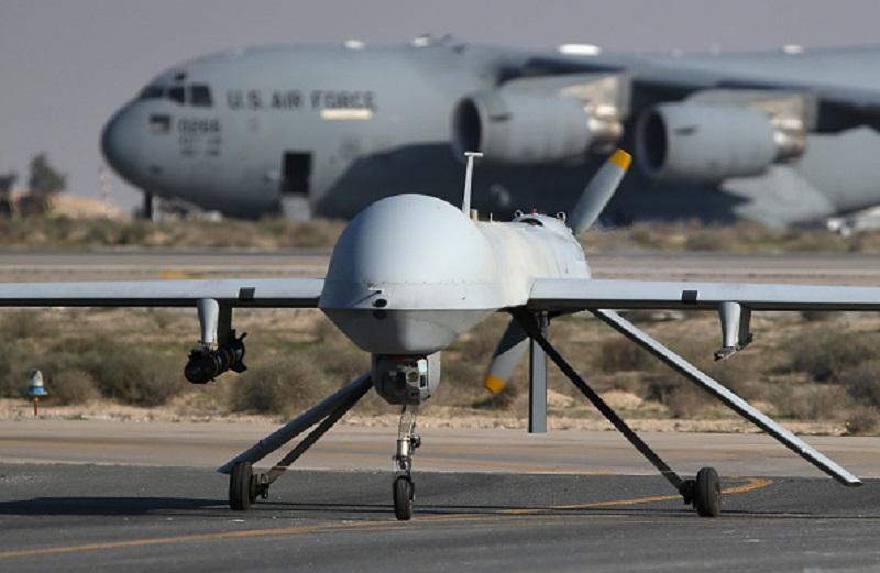 A U.S. Air Force MQ-1B Predator unmanned aerial vehicle (UAV), carrying a Hellfire air-to-surface missile lands at a secret air base in the Persian Gulf region on January 7, 2016.