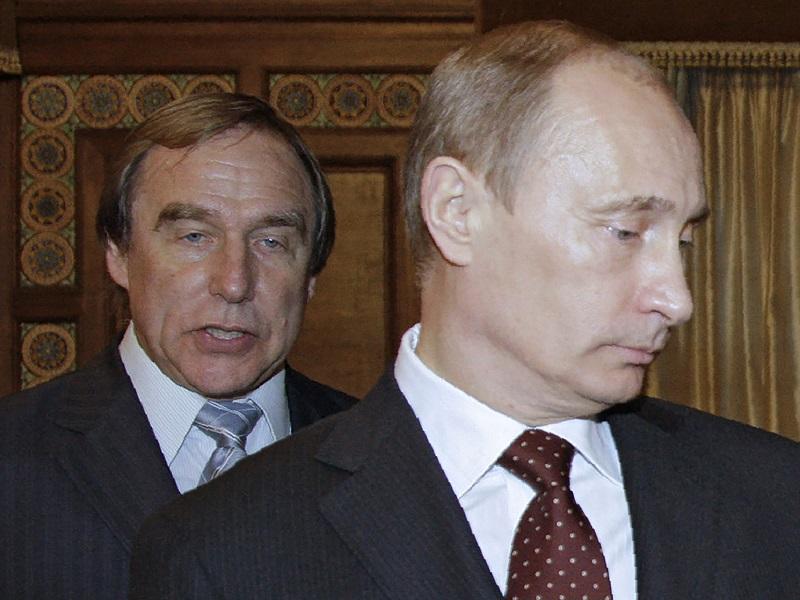 A photo taken 11/21/09 shows Russia's Prime Minister Vladimir Putin (front) and cellist Sergei Roldugin. The 'Panama Papers' leak puts him at the top of an offshore empire worth more than $2 billion.