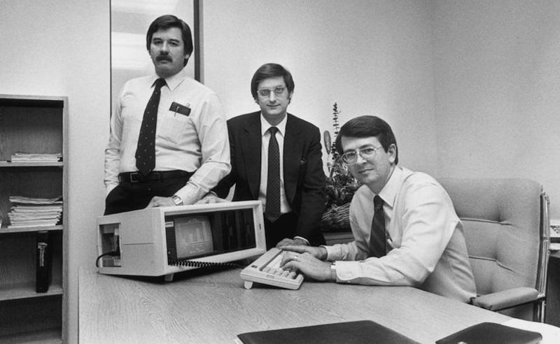 – Compaq Computer Co-founders (L-R: Jim Harris, Bill Murto, Rod Canion) with the first Compaq portable computer.