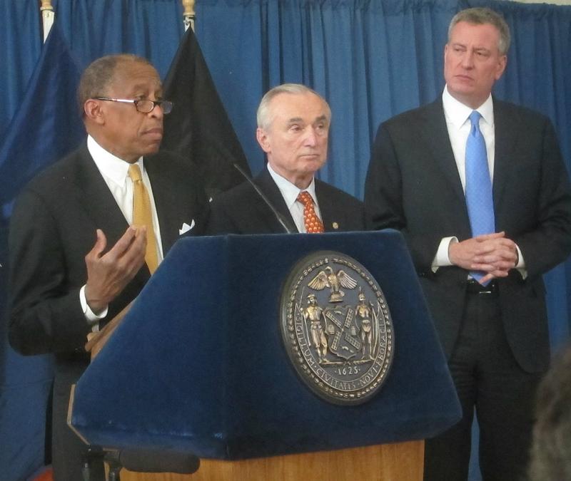 New York City's Corporation Council Zachary Carter, Police Commissioner Bill Bratton, and Mayor Bill de Blasio