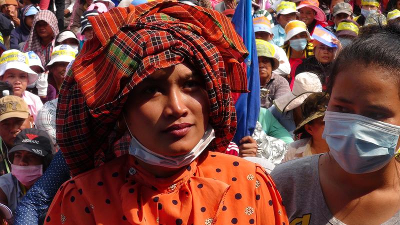 A Cambodian woman attends a demonstration, as seen in the film "Angkor Awakens: A Portrait of Cambodia."