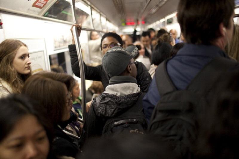 Morning commuters crowd into a subway car March 22, 2012 in New York City.