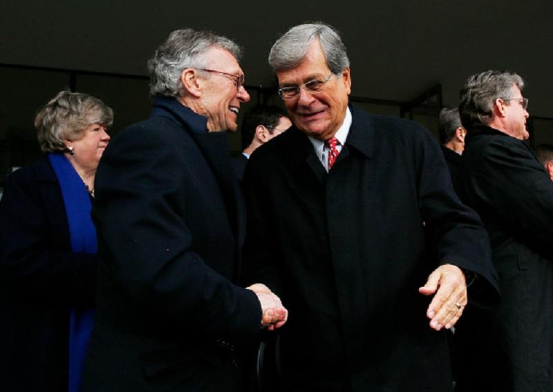 Former US Senator Tom Daschle, left, and former Senator Trent Lott, right, shake hands at the conclusion of a formal ceremony to dedicate the Edward M. Kennedy Institute for the U.S. Senate in Boston.