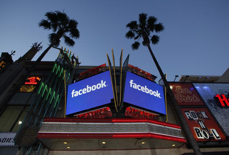Screens outside the Grauman's Chinese Theatre on Hollywood Blvd. advertise Facebook's IPO.
