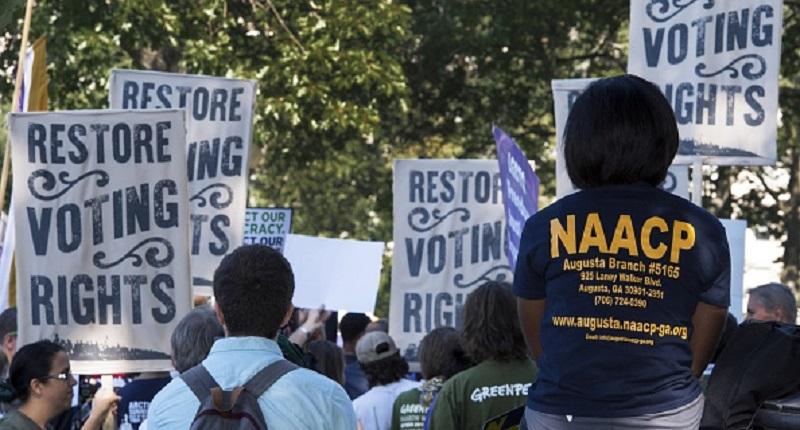 Various labor unions and progressive organizations protest on Capitol Hill on Sept. 16, 2015, calling for the restoration of the Voting Rights Act struck down by the US Supreme Court.