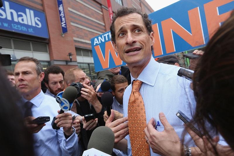 Anthony Weiner is surrounded by media while courting voters outside a Harlem subway station a day after announcing he will enter the New York mayoral race on May 23, 2013 in New York City.