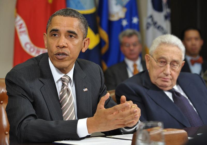 US President Barack Obama speaks during a meeting on the new START Treaty as former Secretary of State Henry Kissinger (R) looks on November 18, 2010 in the White House in Washington, D.C.