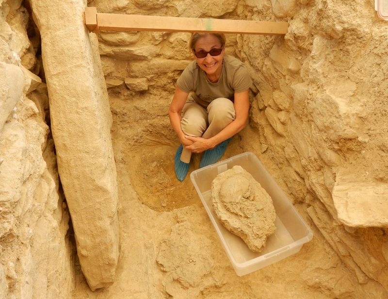 Sharon Stocker with the 3,500 year-old skull found in the warrior's tomb.