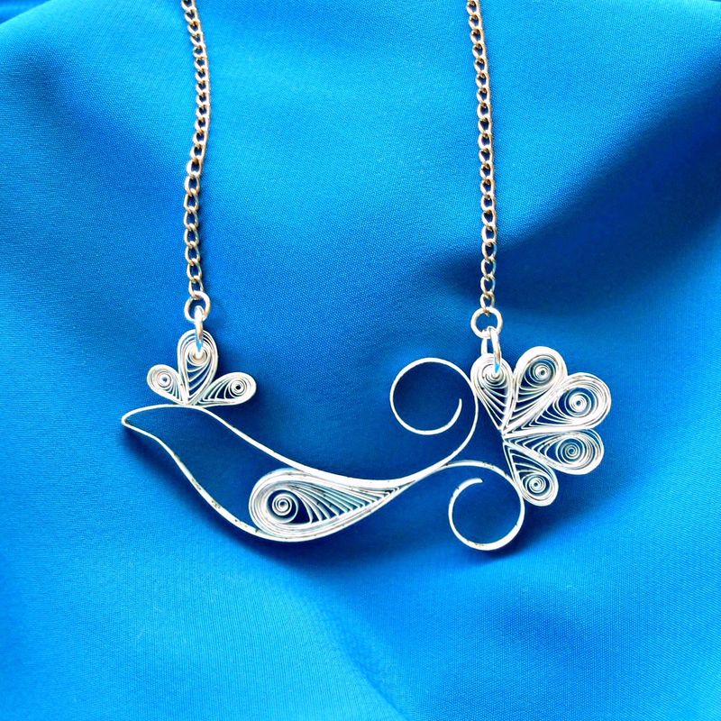 Ann Martin's 'Bluebird of Happiness' pendant is made from a cut-up IRS form 1040